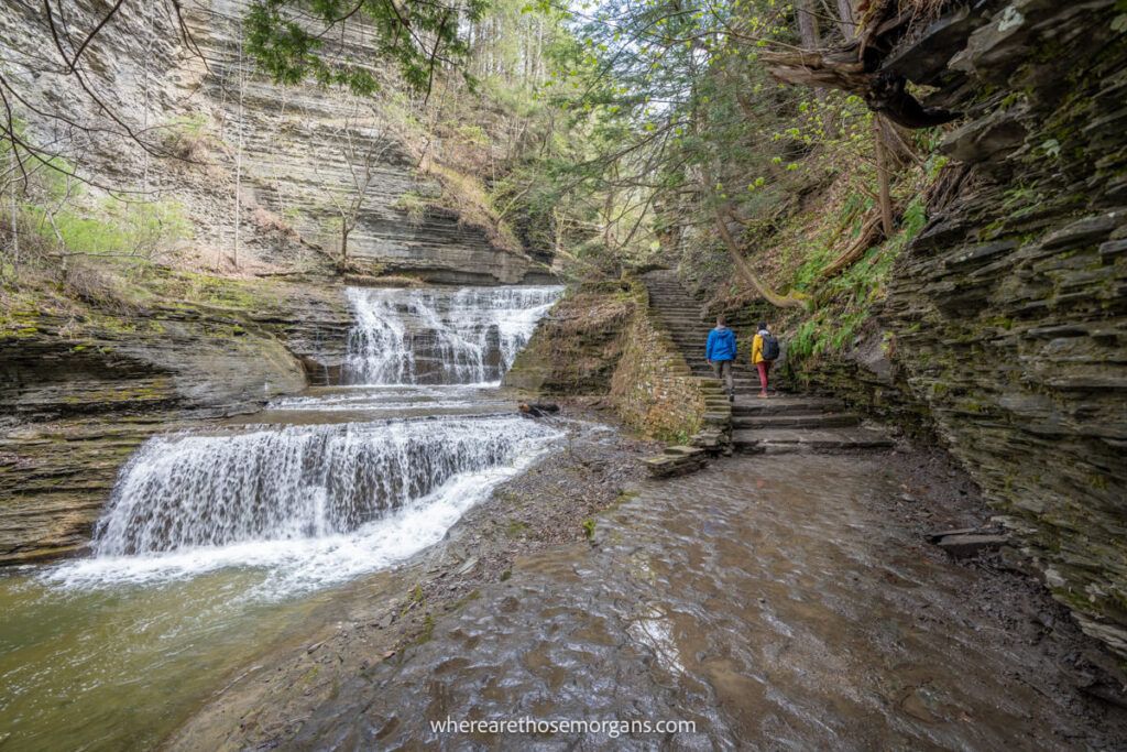 Two people walking along a Gorge Trail in the Finger Lakes