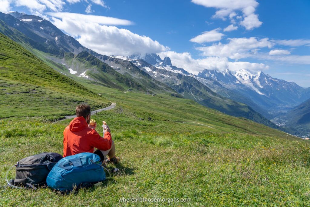 Man taking a break and eating lunch while a hike