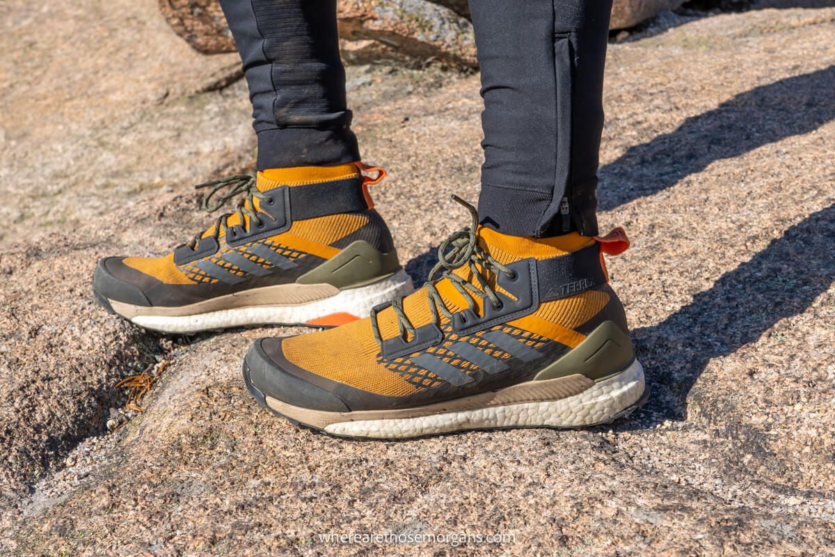 Man wearing bright orange adidas terrex hiking boots