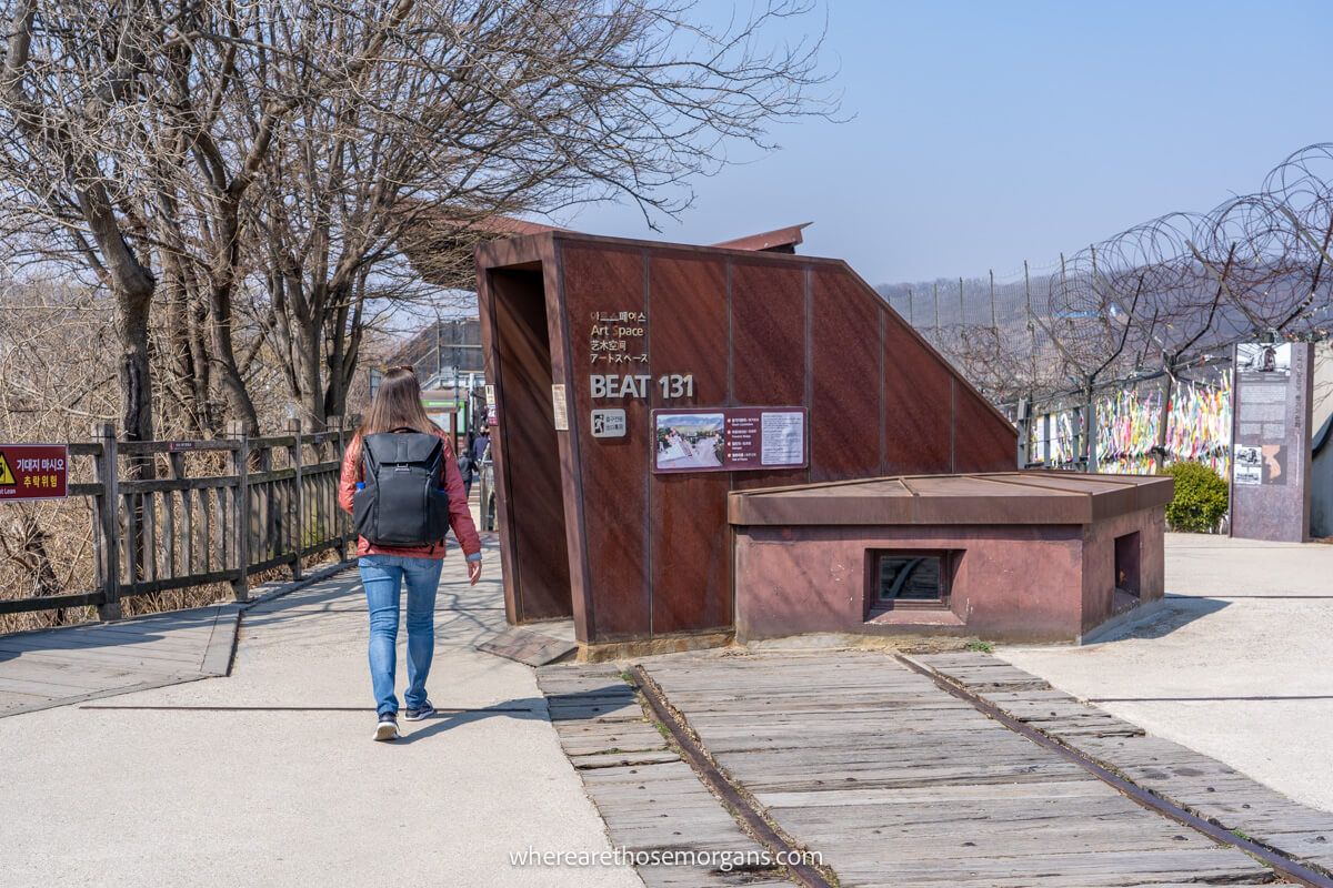 Woman walking near the exhibition hall for the Underground Military Bunker