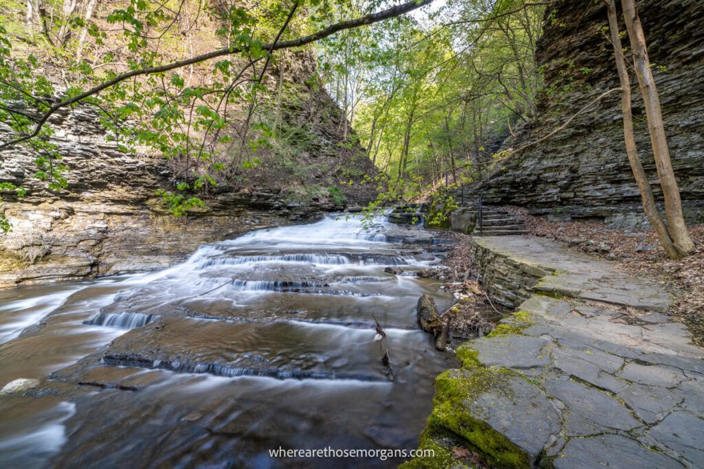 Cascadilla Creek in Ithaca, NY with stone walkway and gently cascading waterfalls