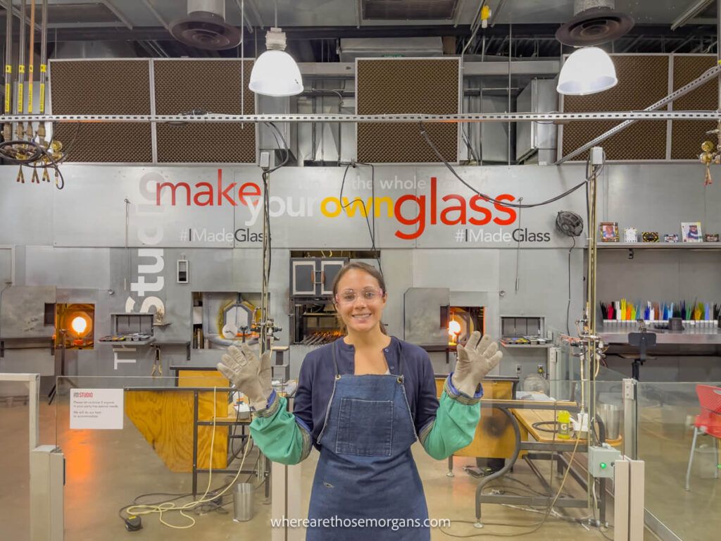Woman in protective gear the Corning Museum of Glass