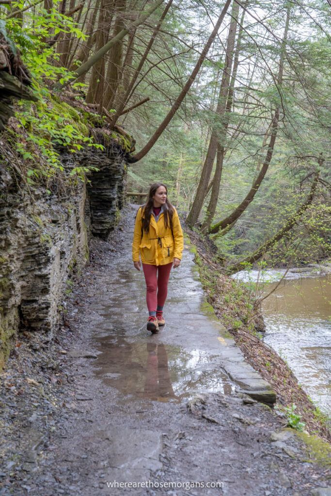 Woman walking along a stone walkway in a New York State Park