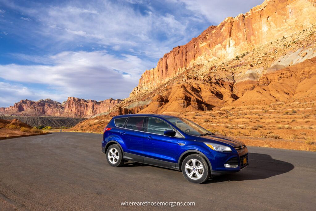 Ford SUV parked along a section of the scenic drive in Capitol Reef for a photo