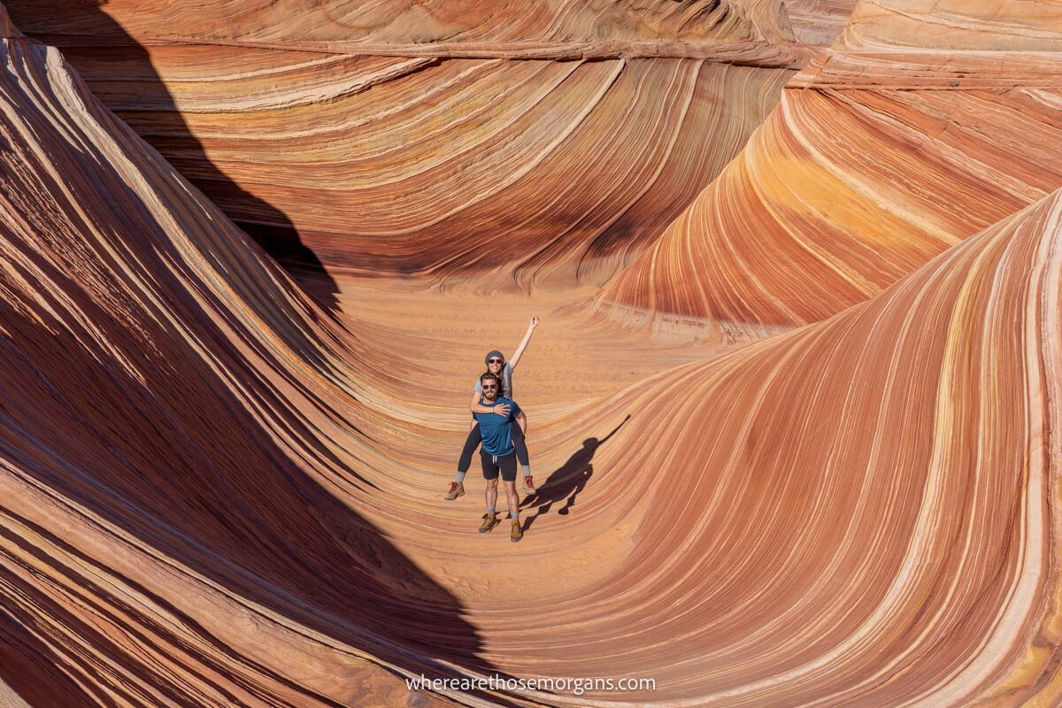 Photo of a couple hiking in The Wave near Kanab in Utah