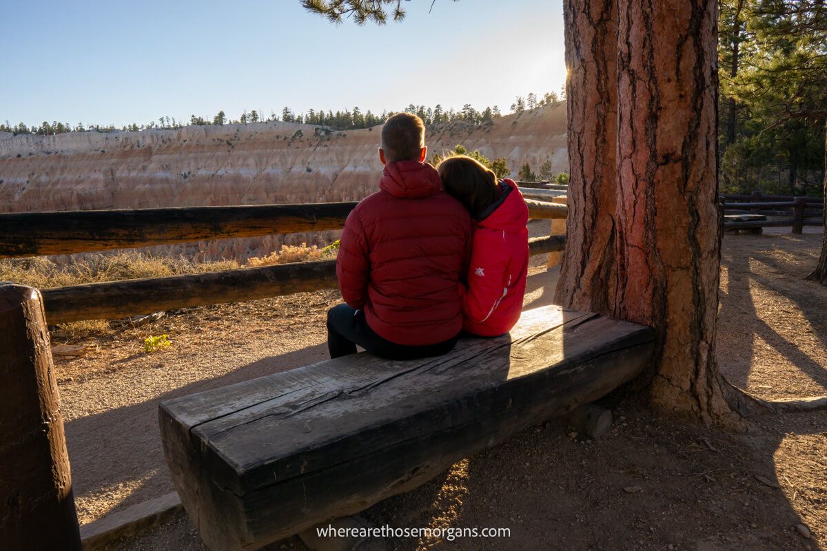 Couple sat on a bench in Bryce Canyon waiting for the sun to set