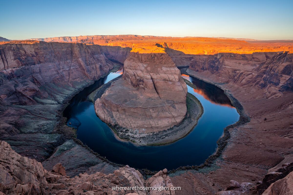 Horseshoe Bend lighting up at sunrise makes for a staggeringly attractive stop to make on a Utah road trip just across the border in Arizona