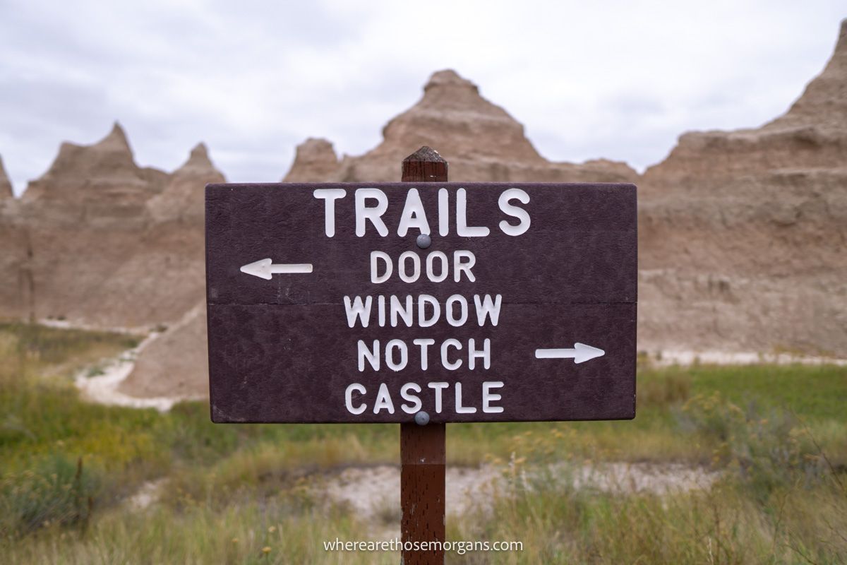 Wooden sign indicating the trails for doors, window, Notch and Castle