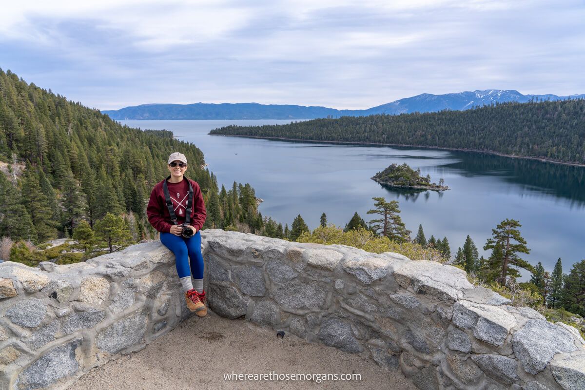 Photographer sat on a wall in Emerald Bay State Park California