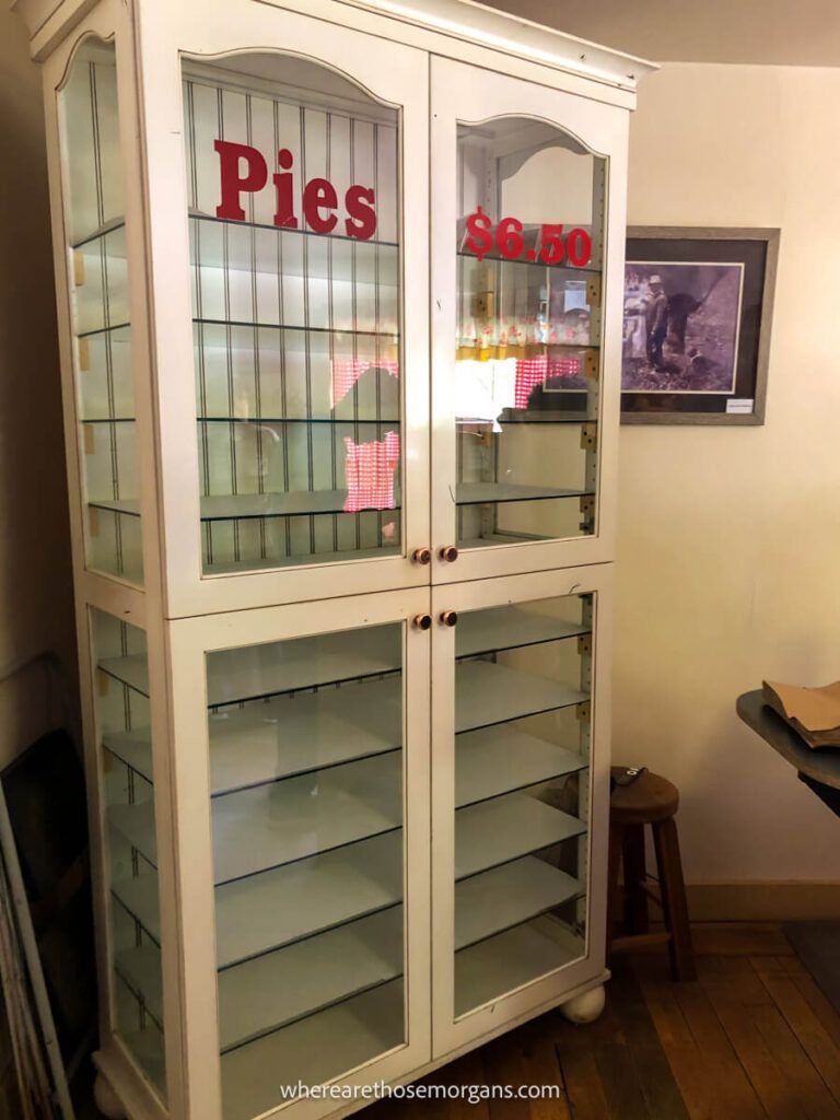 Empty white pie cabinet with no pies for sale