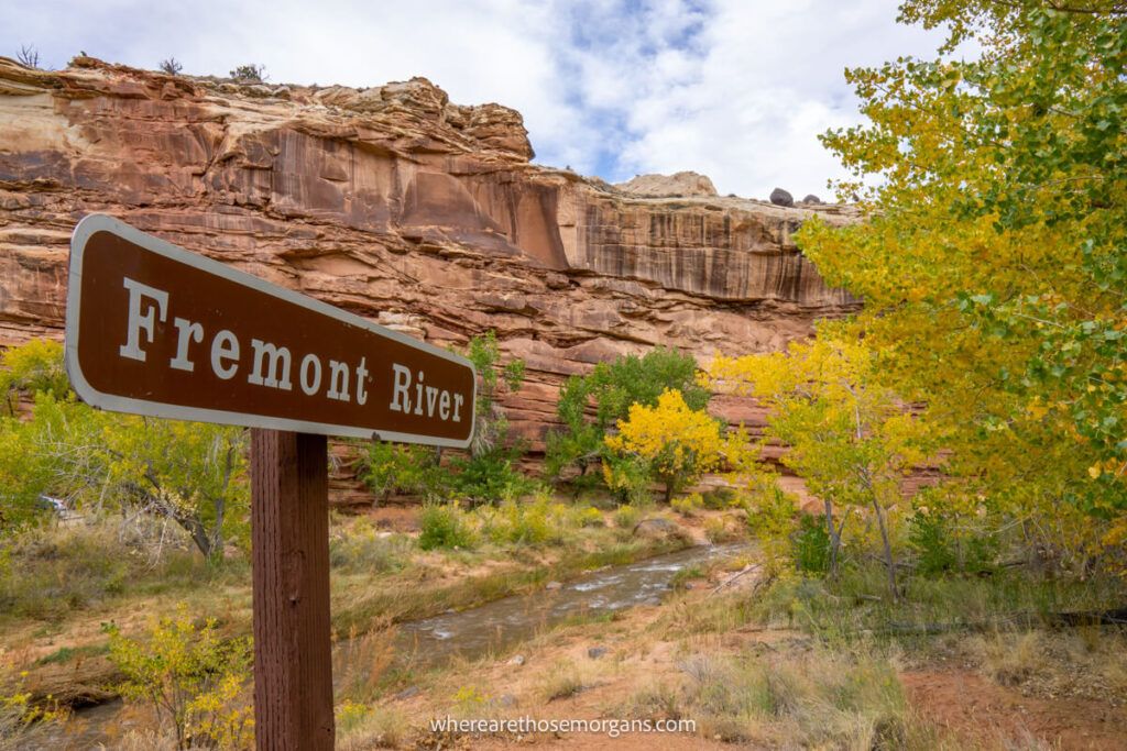 Fremont River sign with bright yellow fall foliage