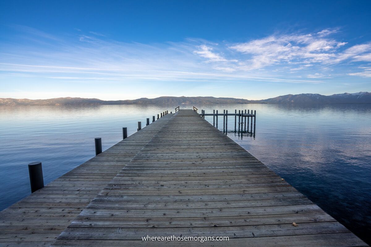 Wooden pier jutting out into Lake Tahoe at sunset
