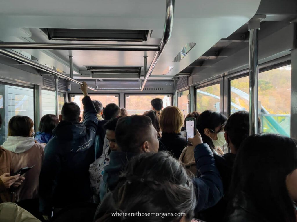Namsan cable car filled with visitors heading up the mountain