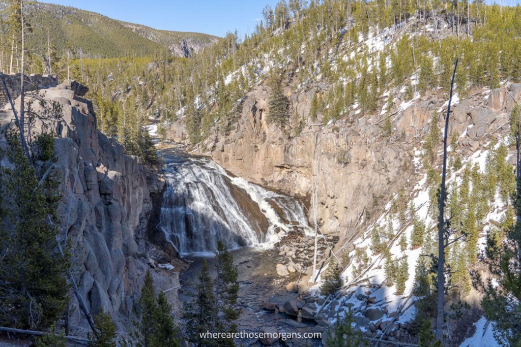Gibbon Falls in Yellowstone National Park with snow on the ground