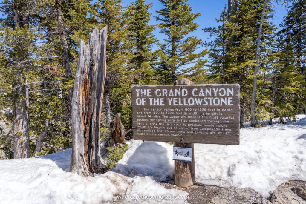 Brown wooden sign for the Grand Canyon of the Yellowstone River one of the best places to visit in Yellowstone