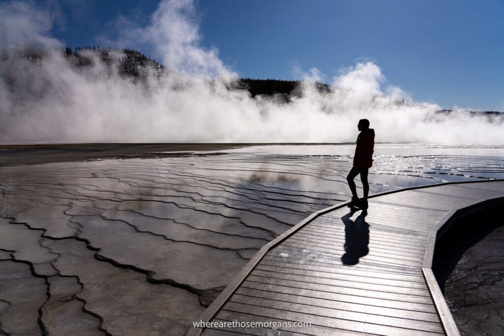 Woman standing on the boardwalk of Midway Geyser Basin