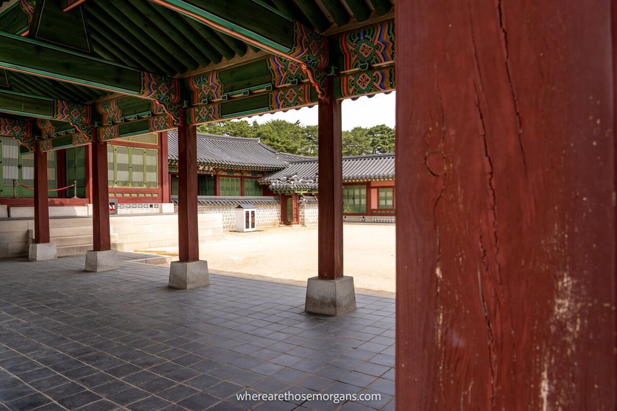 Beautiful colored ceilings in Gyeongbokgung Palace with red pillars
