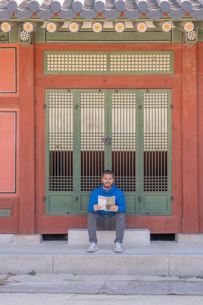 Man posing for a photo at Deoksugung Palace in Seoul