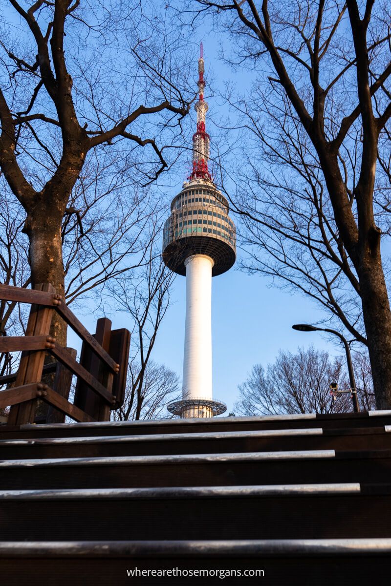Perspective photo of a staircase and Namsan Seoul Tower one of the best things to see in Seoul