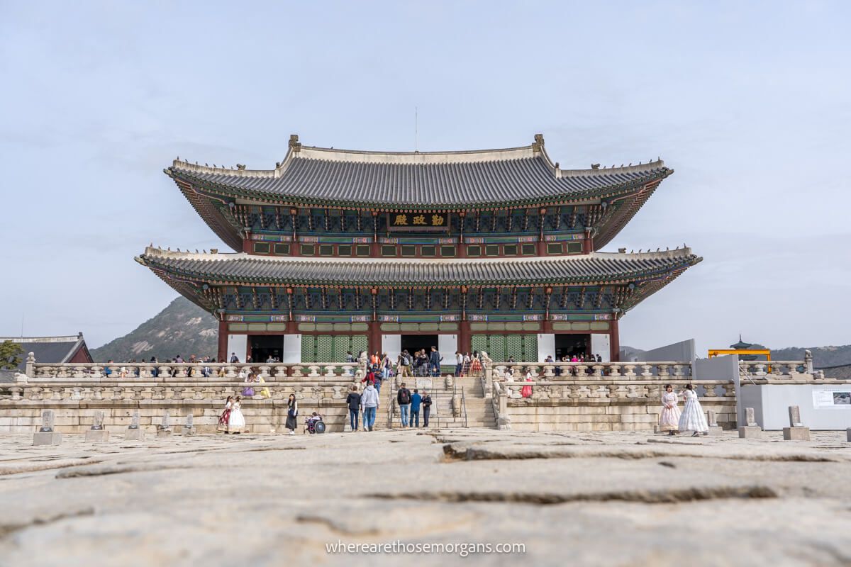 Many tourists exploring the main hall at Gyeongbokgung, one of the most popular palaces in Seoul South Korea