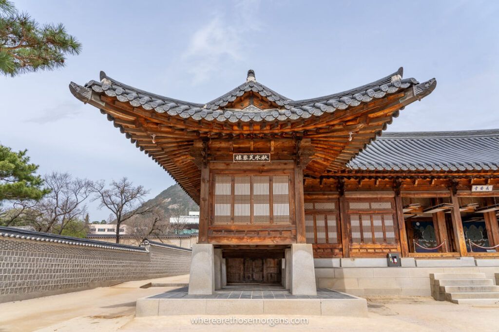 A wooden building inside Gyeongbokgung Palace with a unique roof