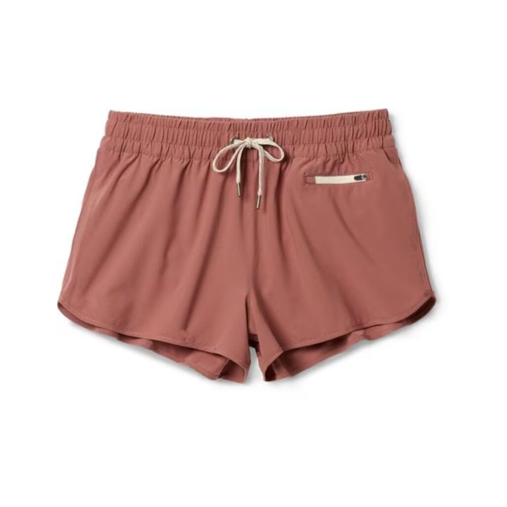 A pair of red Clementine shorts by Vuori are the best outdoor adventure shorts for women