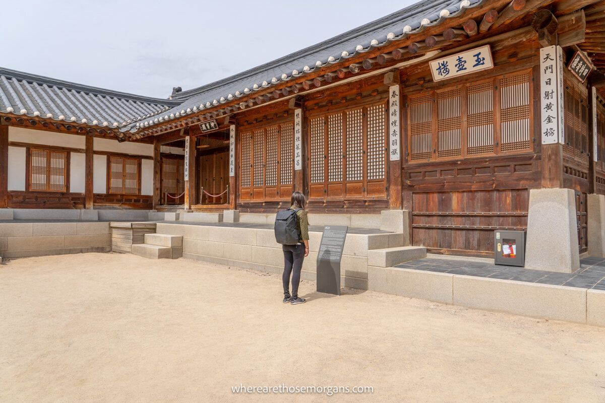 Tourist reading an information board inside a palace in Seoul