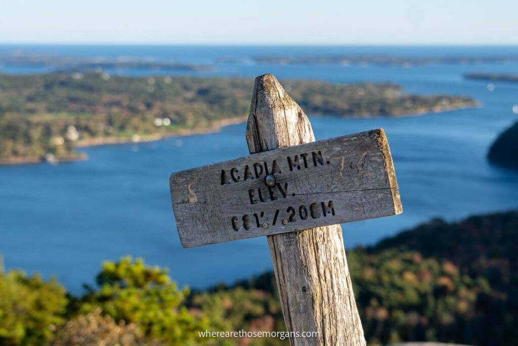Brown wooden sign at the top of Acadia Mountain indicating the elevation