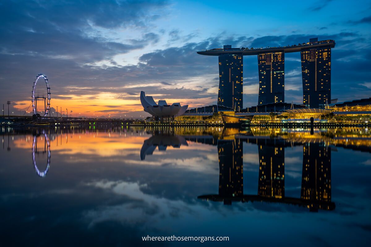 Marina Bay Sands hotel in Singapore at sunrise with reflection in water