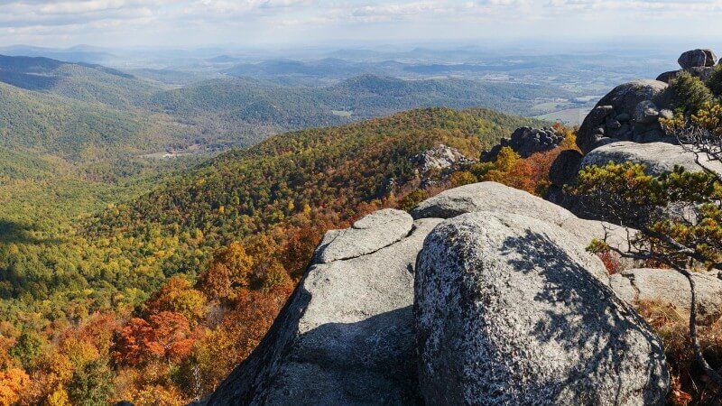 Old Rag Trail in Virginia colorful fall foliage leaves rolling hills from a rocky summit