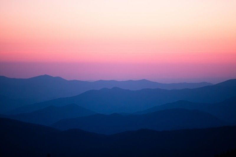 Calming peaceful dawn colors with silhouetted rolling mountains in Great Smoky Mountains North Carolina the most visited park in the USA
