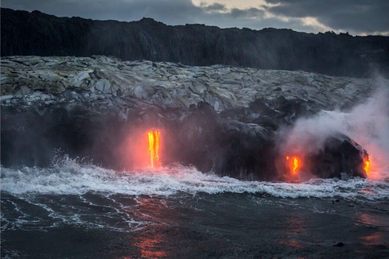 Molten lava pouring into the Ocean at Hawaii Volcanoes National Park