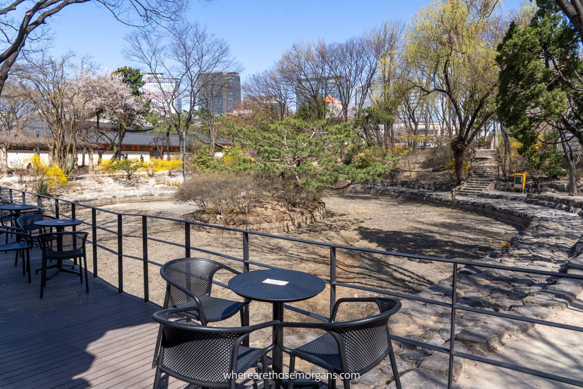 An empty pond with tables and chairs