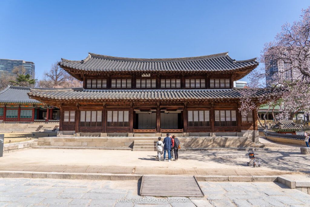 Visitors stopping to admire Seogeodang Hall in Seoul