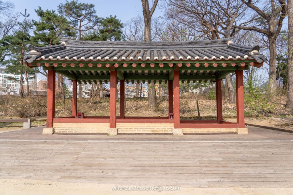 Small red and wooden pavilion with roof