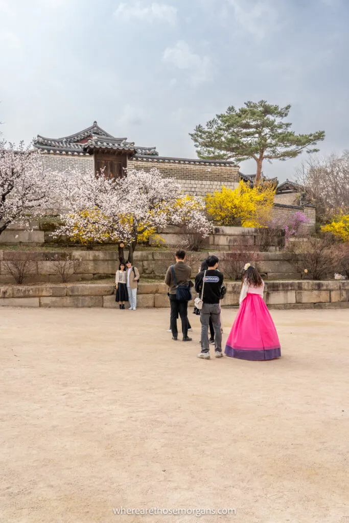 A visitor inside a Seoul Palace wearing a hanbok