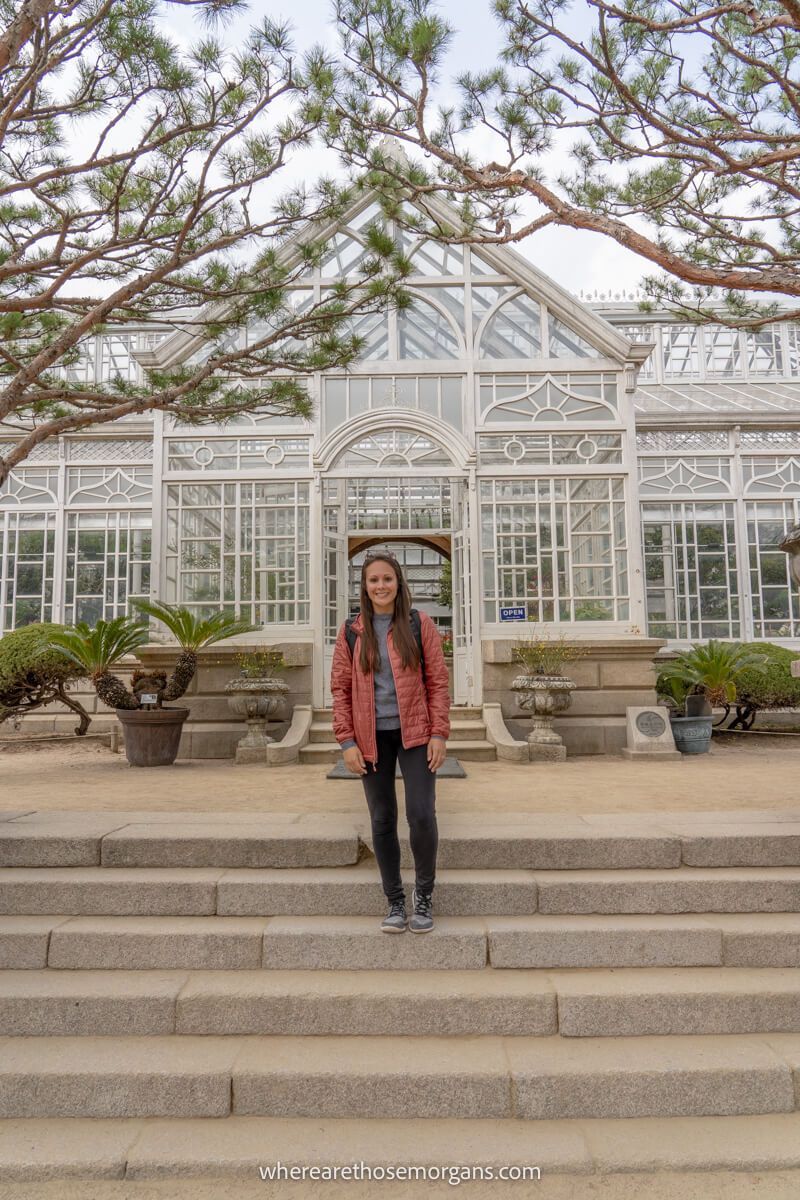 Woman standing in front of the Grand Greenhouse in Seoul, South Korea