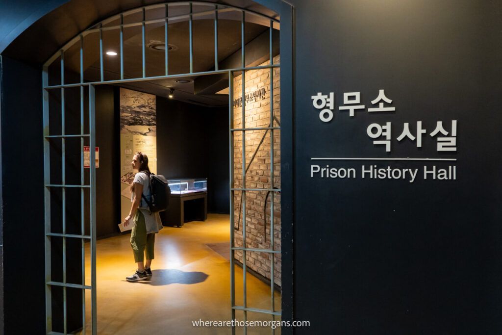 Woman reading about the Prison History Hall in Seoul