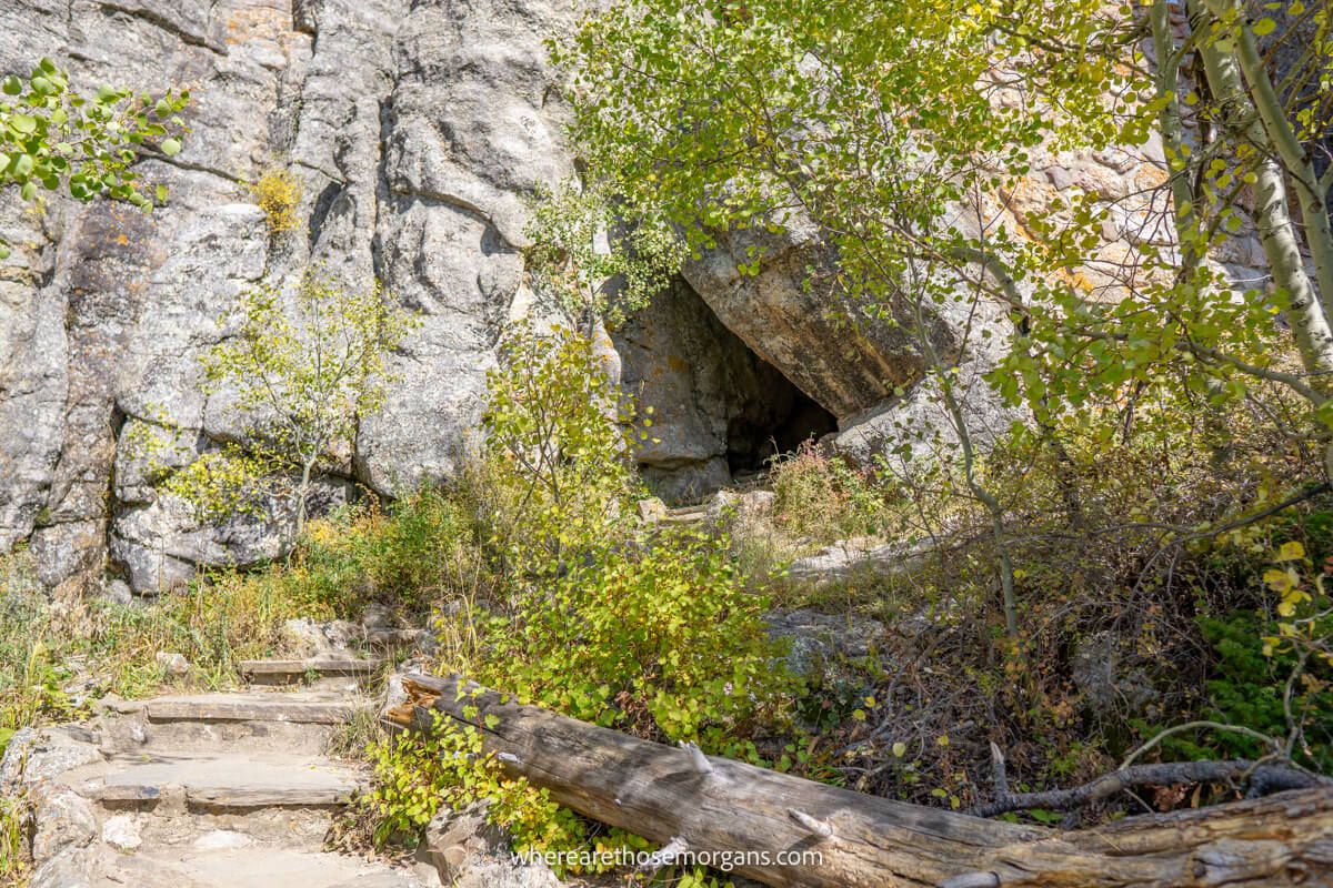 Stone steps leading into a cave-like hole in a rock