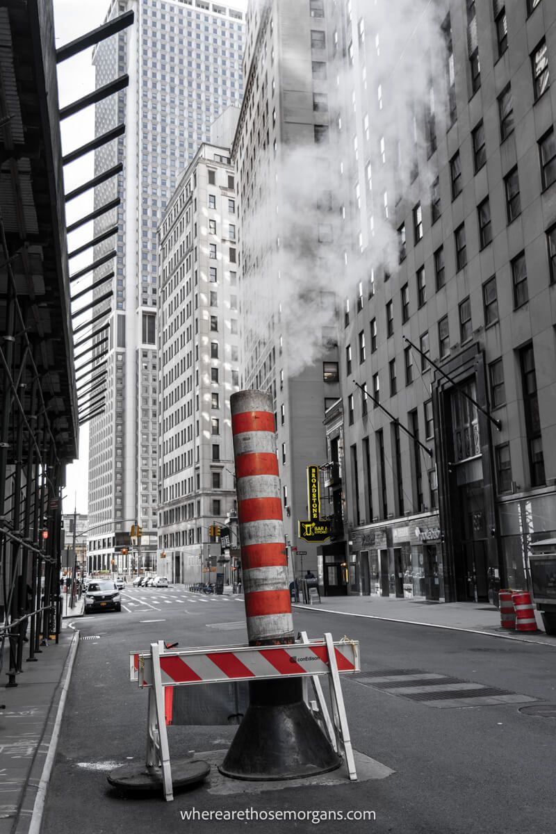 Steam pipe with billowing steam on a road making a fun and unique New York City photo