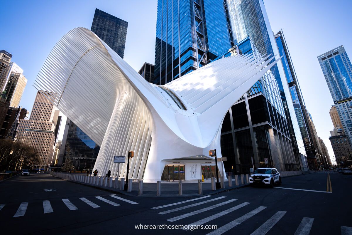 Exterior of Oculus in NYC a white dove shaped building surrounded by skyscrapers