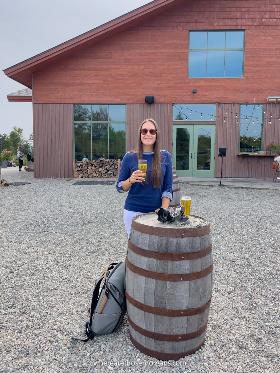 Woman drinking an ice cold beer at the Von Trapp Brewery near Stowe, Vermont