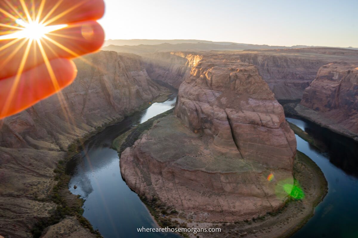 Photo of a hand blocking the sun with a starburst of the sun coming through gaps in the fingers next to a view of a natural river formation in Arizona