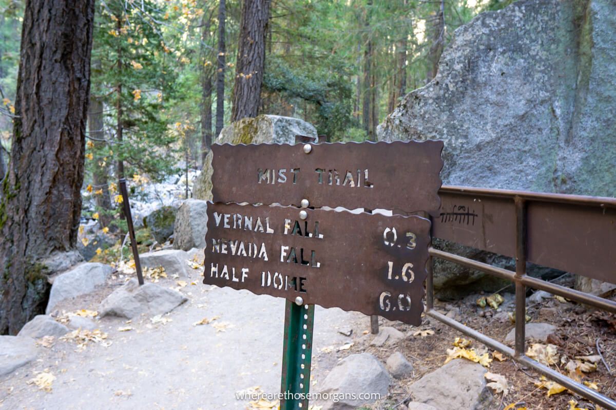 Metal sign with letters cut out on a forest hike in Yosemite