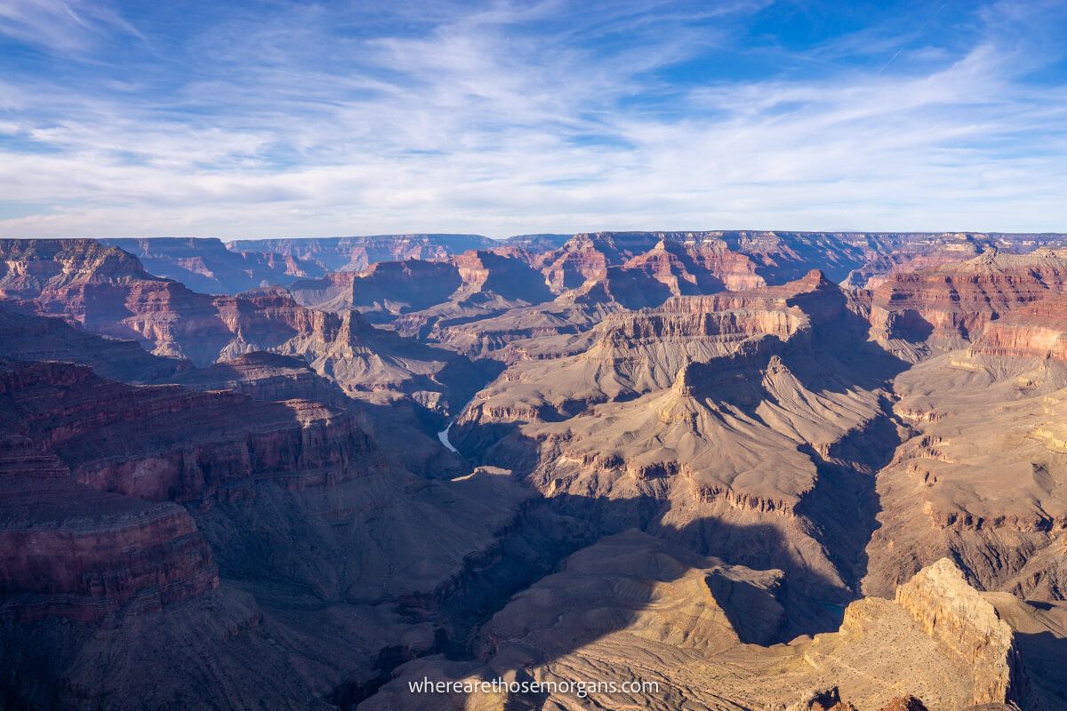 Deep shadows contrasting with bright light across a sweeping rocky landscape in Arizona