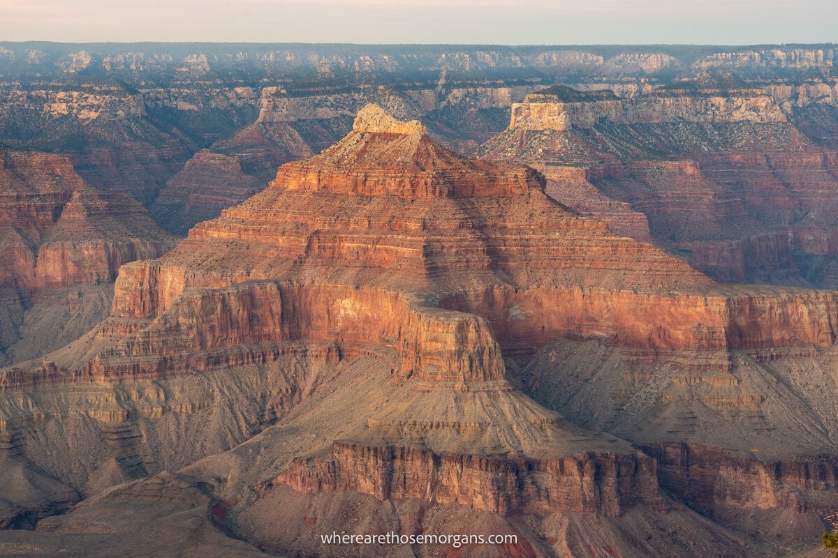 Close up of gigantic red and orange sandstone rock formations in a wide open landscape