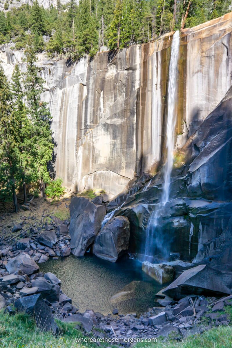 Photo of a thin waterfall dropping over a flat shelf and plummeting into a small round pool at Vernal Fall on the Mist Trail in Yosemite