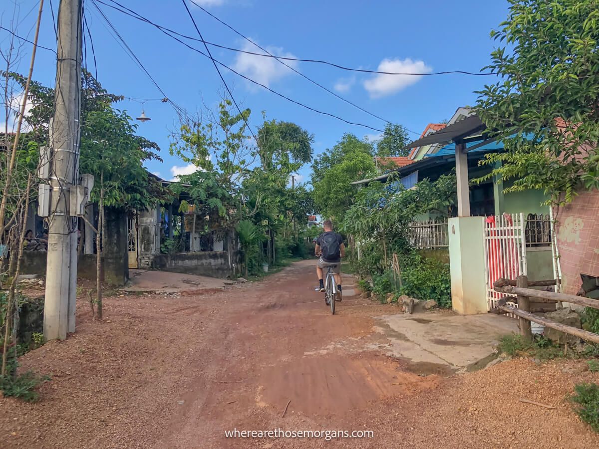 Person biking along a dirt road in Vietnam
