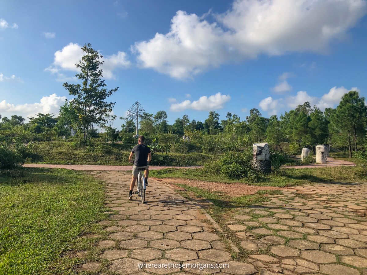 Person biking through the abandoned waterpark in Hue