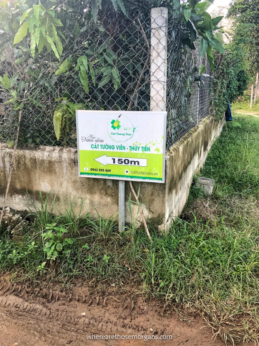 White and green sign point to an abandoned waterpark